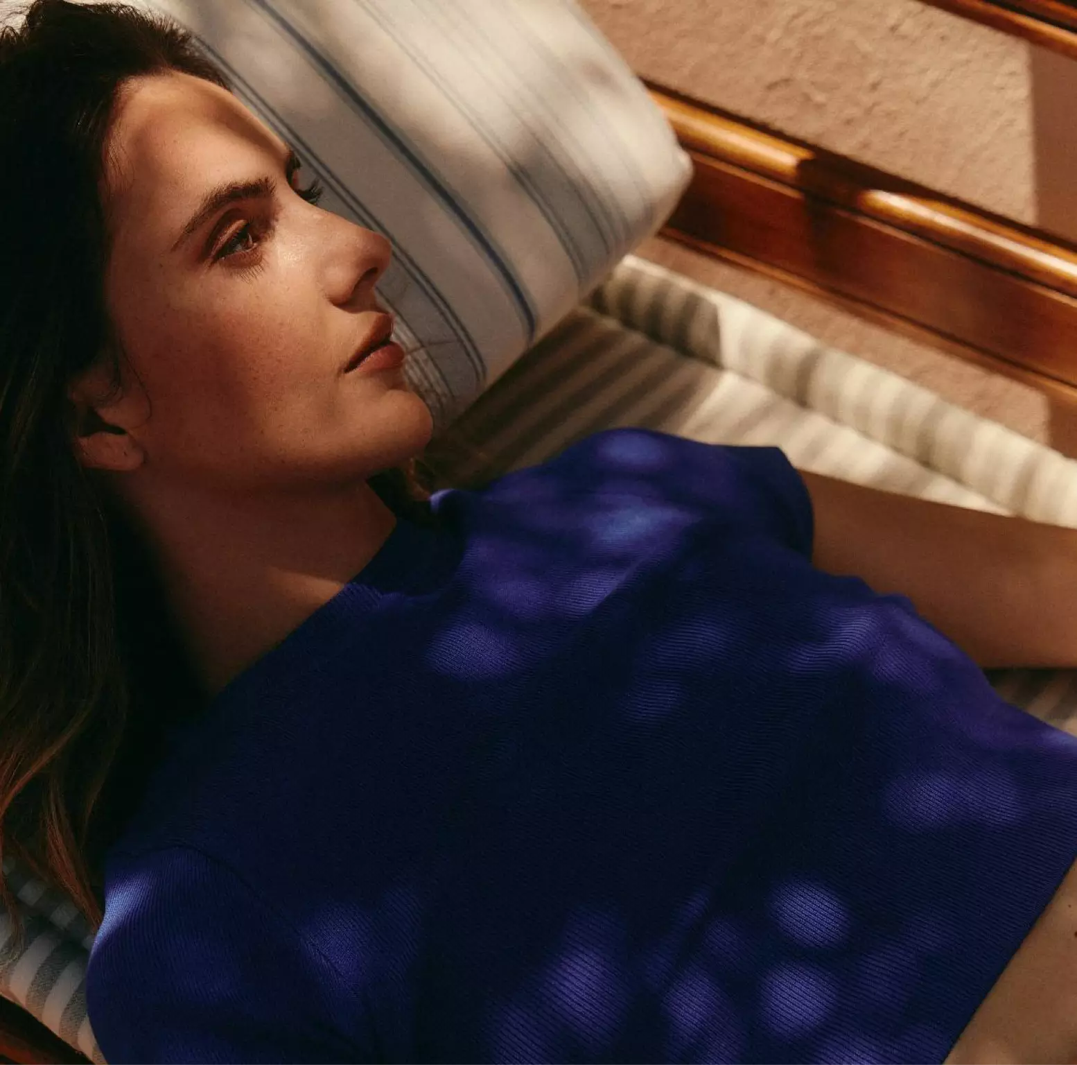 Person resting peacefully on a lounge chair, symbolizing calm and recovery.