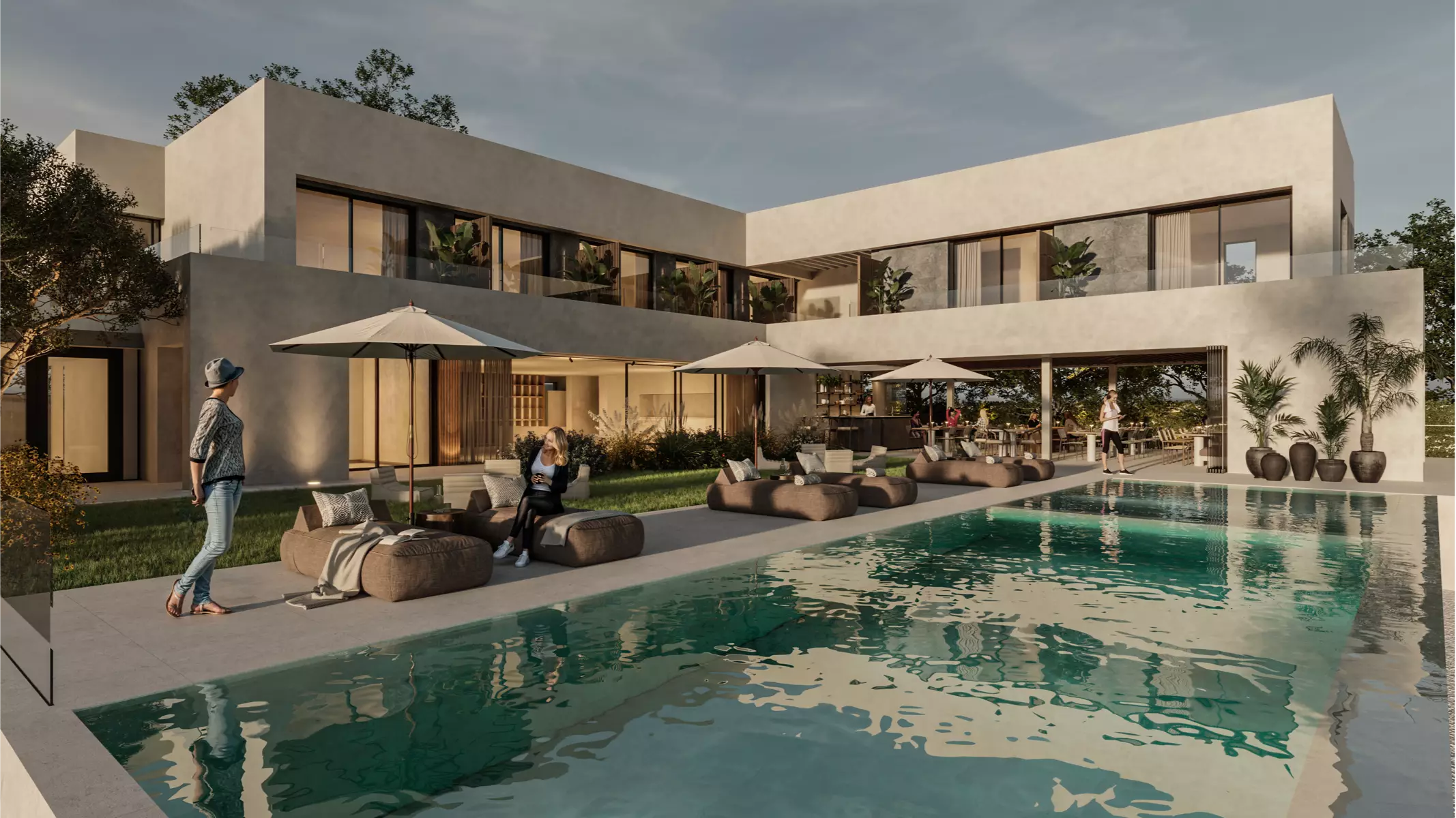 Modern outdoor pool area at Naghoi with lounge chairs, parasols, and open-air dining space for patient relaxation and social connection.